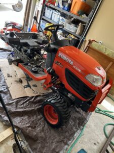 A red tractor sitting on top of a table.